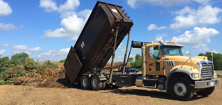 MDI roll-off container unloading at waste management site