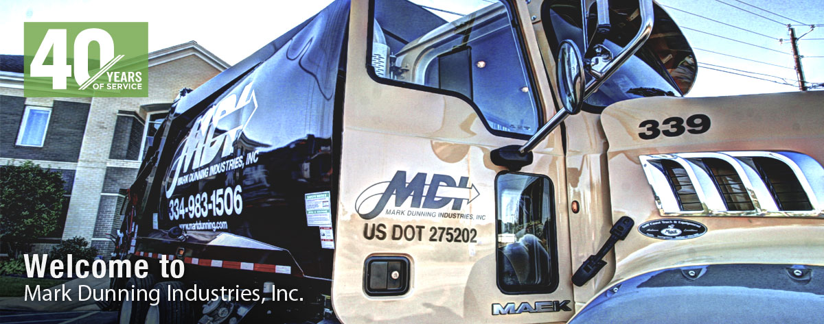 MDI rear load truck in front of corporate headquarters.